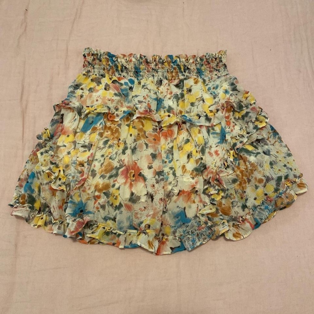 Out from under floral skirt